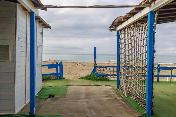 istock Wood Building Built on the Beach, Deserted and Desolate Beach in Winter Time 1486713668