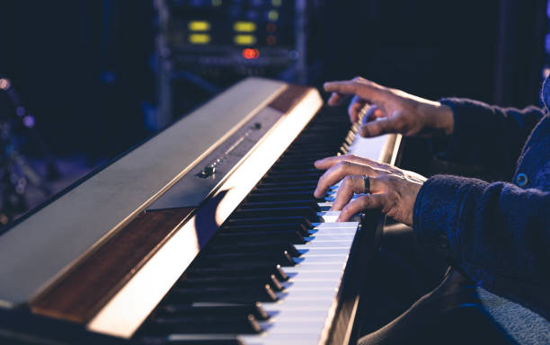istock A man plays the electronic piano, hands close-up. 1486723398