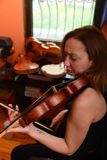 istock Woman Instrument Maker plays the accordion 1486723601