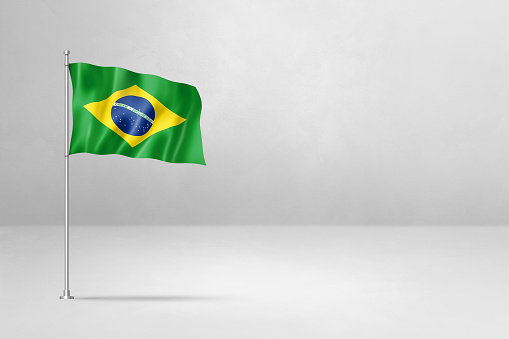 Brazilian Flag on cracked wall background.