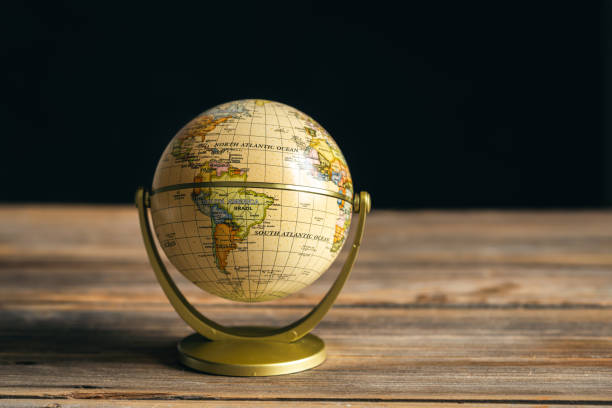 istock Earth globe on a wooden surface, close-up. 1486724577