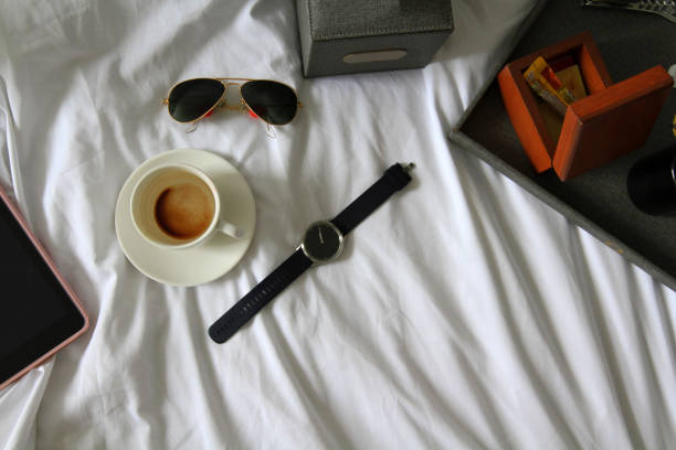 istock Group of object on bed such as watch, coffee, sunglasses 1486730916