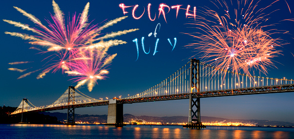 Fireworks over Bay Bridge, San Francisco, California, USA.