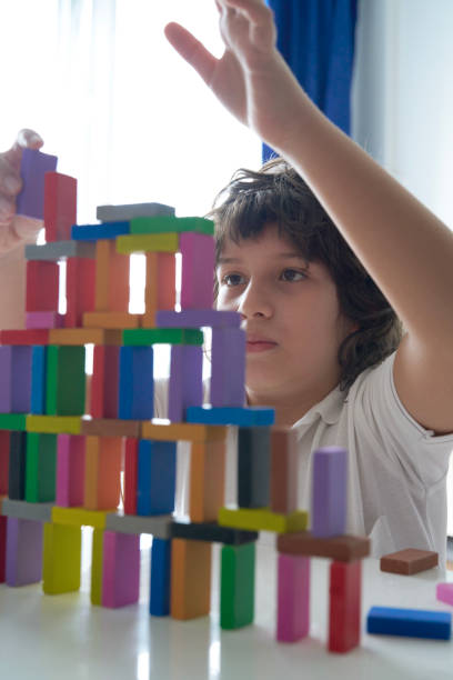 istock Cute Little Boy Playing with wooden block 1486731624