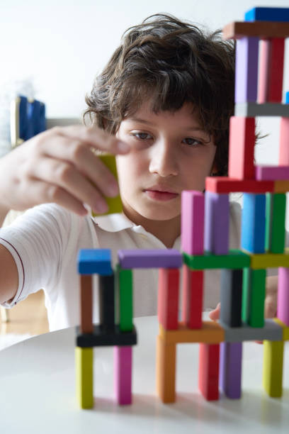 istock Cute Little Boy Playing with wooden block 1486731666