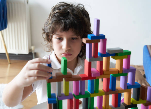 istock Cute Little Boy Playing with wooden block 1486731820