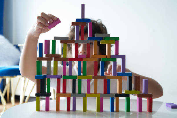 istock Cute Little Boy Playing with wooden block 1486731912