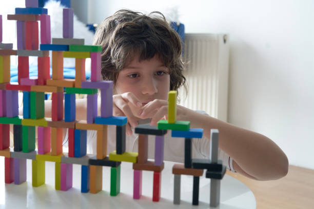 istock Cute Little Boy Playing with wooden block 1486731991