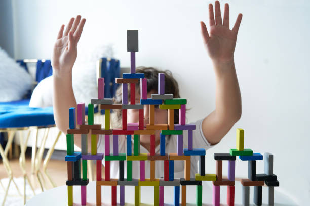 istock Cute Little Boy Playing with wooden block 1486732115
