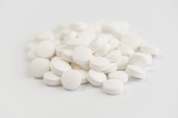 istock Zinc white pills on white background 1486732252