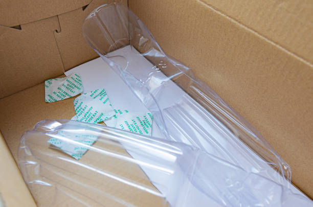 istock Empty cardboard shoe box with packets of silica gel with descriptions 