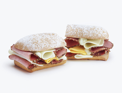 A great sandwich with bacon and cheddar cheese. on a white background