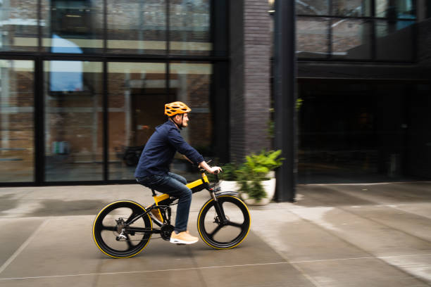 istock E-mobility commute to work businessman on electric bicycle. 1486733897