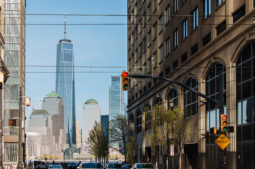 Typical buildings in Jersey City with the One World Trade Center NY on the background.