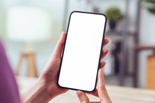istock Hand holding digital smartphone mockup of blank screen. Take your screen to put on advertising. 1486739607
