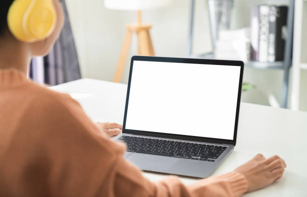 istock Woman hand working on laptop with blank copy space screen, mock-up for the application. 1486740105