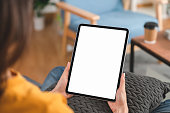 Hand holding digital tablet mockup of blank screen. Take your screen to put on advertising.