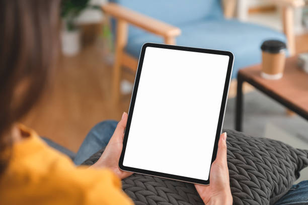 Hand holding digital tablet mockup of blank screen. Take your screen to put on advertising. stock photo