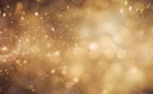 istock Gold glitters background. shimmering blur spot lights Bokeh Shiny gold light background texture 1486743432