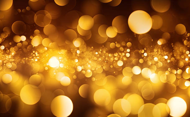 istock Gold glitters background. shimmering blur spot lights Bokeh Shiny gold light background texture 1486743447