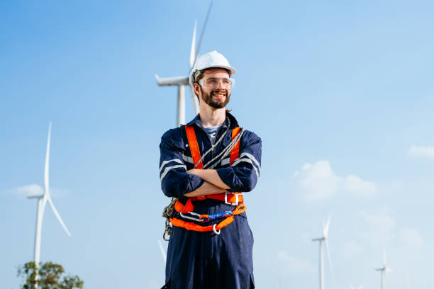 Professional maintenance engineer working at wind turbine farm