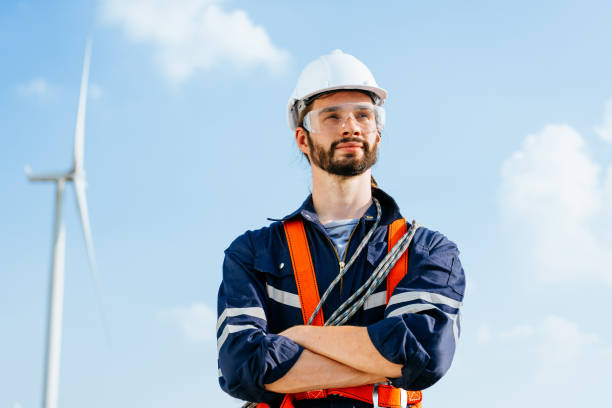 istock Professional maintenance engineer working at wind turbine farm 1486743731