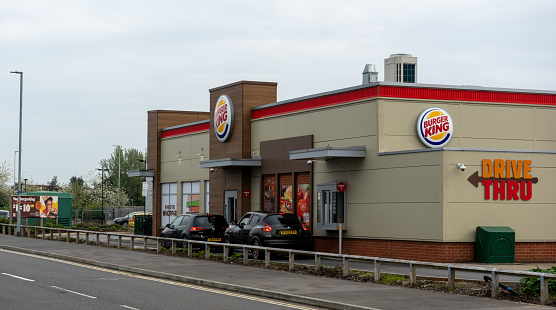 Reading, UK: Cars queuing at a Drive Thru Burger King Restaurant.