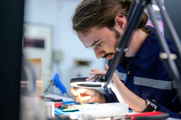 istock Male technician checking and repairing part of automatic machine 1486750260