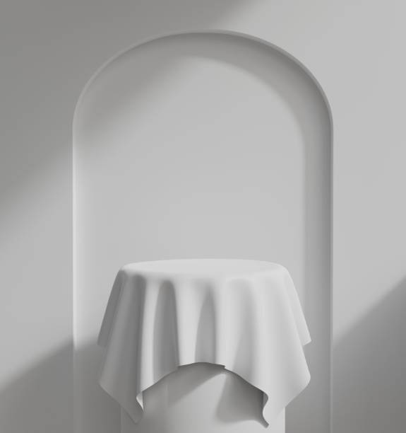 istock empty white podium.3D display podium on white background.Stand Minimal mockup for presentation.Abstract white background concept.Geometric platform show cosmetic product.Stage showcase.3D rendering 1486751210