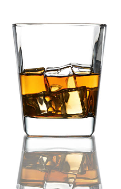 istock Whiskey glass witch ice. Isolated on white background with reflection 1486753603