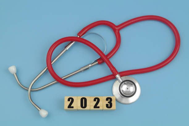 istock Red stethoscope and numbers  2023 on wooden cubes. 1486754083