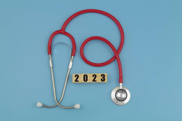 istock Red stethoscope and numbers  2023 on wooden cubes. 1486754458