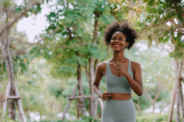 istock woman runner jogging outdoors in the park 1486754522