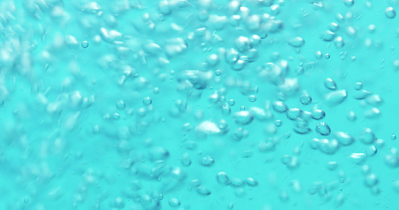 underwater air bubbles in blue water pouring, 4k photo
