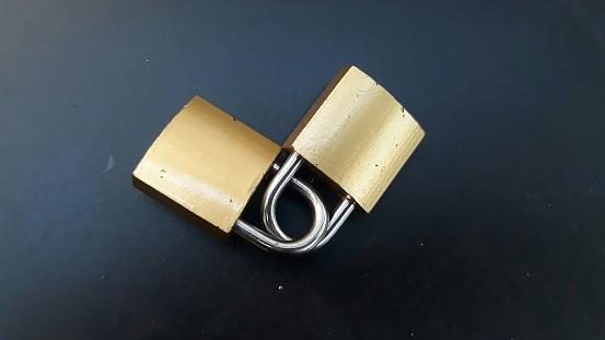 Two gold locks interlocked