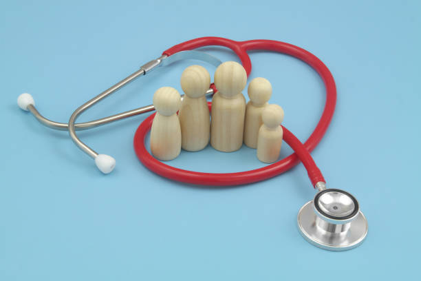 istock Red stethoscope with  family people figures on blue background. 1486756763
