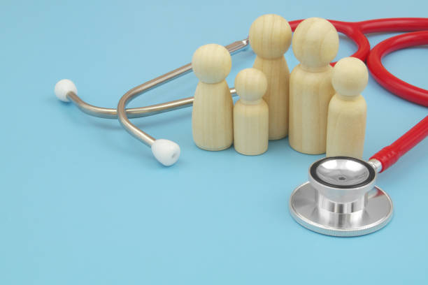 istock Red stethoscope with  family people figures on blue background. 1486756867