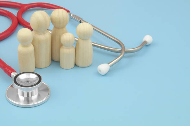 istock Red stethoscope with  family people figures on blue background. 1486756869