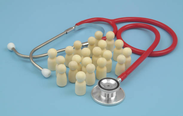 istock Red stethoscope with  many people figures on blue background. 1486756893