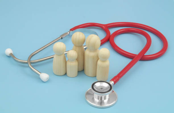 istock Red stethoscope with  family people figures on blue background. 1486756894
