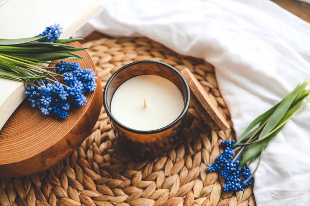 istock Candle and flowers in home atmospheric interior 1486760810