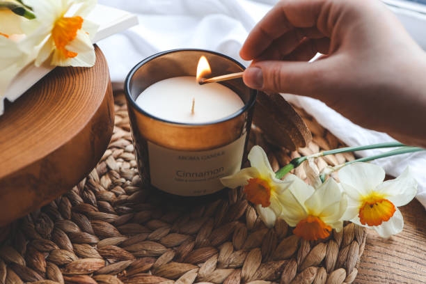 istock Match in hand lights a candle, atmospheric photo 1486760820