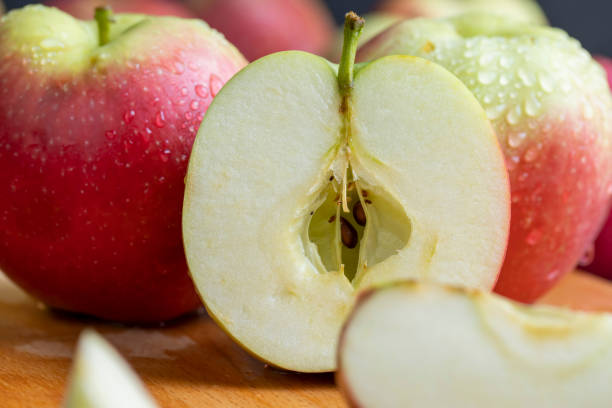 istock Sliced apple on a chopping board, close up 1486762289
