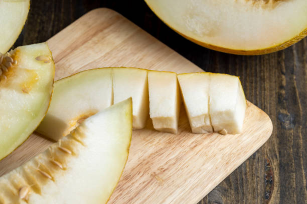 istock Sliced orange sweet melon close up 1486764355