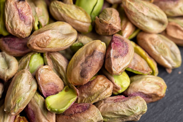 istock Crispy delicious pistachios with salt on the table 1486765237