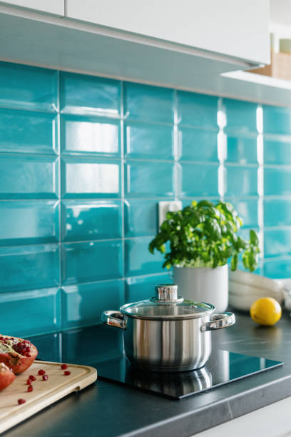 istock cozy kitchen with saucepan, kitchenware and electrical built in hob 1486765267