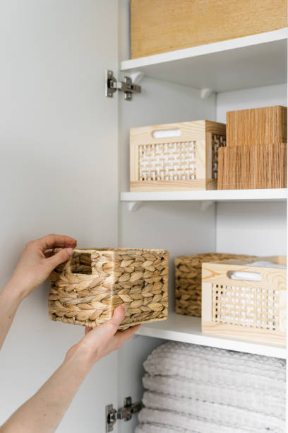 istock woman take storage box from wardrobe at home, closeup 1486766267