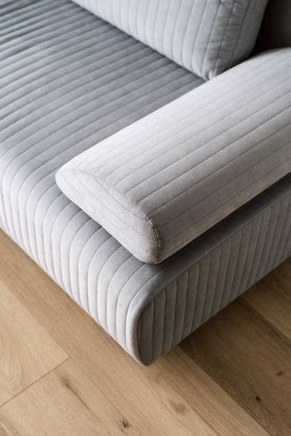 new modern sofa with quality fabric cover in store high angle view on couch corner with grey upholstery and comfortable armrest in living room, repair and restoration furniture concept, dry cleaning service couch arm rest stock pictures, royalty-free photos & images
