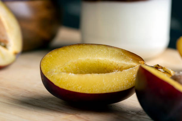 istock Ripe plums cut into pieces during cooking 1486768228