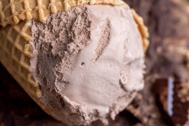 istock chocolate ice cream in a waffle cup on chocolate 1486768229